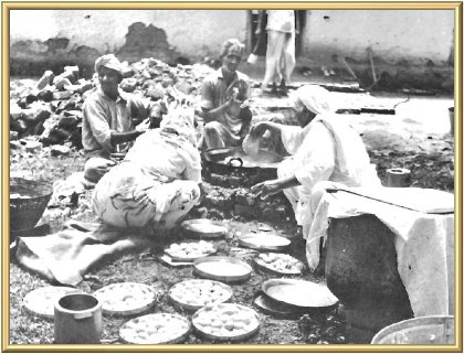 Bibi Hardevi Ji directs the outdoor kitchen