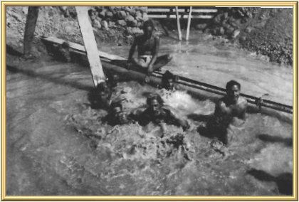 Water experts demonstrate how they brought out the force of the powerful natural spring which will feed the lake.