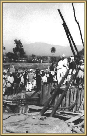 A large support from special wood is sunk into the ground, to surround the spring and prevent mud caving in and blocking the flow.