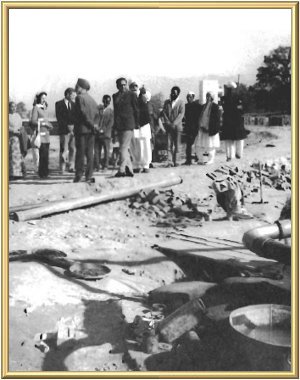 The Master shows him around the Centre, accompanied by Satsangis from the West.