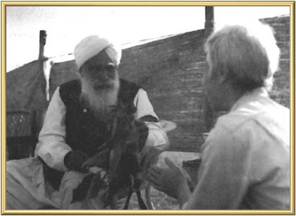 The Father takes time to give one of His children (Swami Yogeshwananda from England) a poinsettia on Christmas Day.