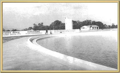 The filled lake. In the distance is seen the wall which bounds the bathing section, the water tower, and Master’s cottage.