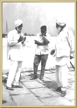 The Master talks it over with the architects.