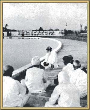 The Master with His children at the Pool of Immortality (Mansarovar) at Manav Kendra.