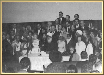 Kirpal Singh is sitting with His workers.