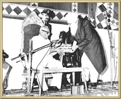 The President accepts a set of the Master’s books.