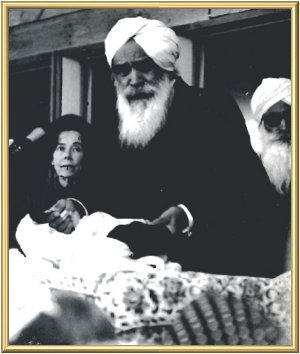 The Master on the dais at the Satsang Hall at Sant Bani Ashram, Sanbornton, New Hampshire, during the course of the extraordinary Satsang in the evening of 19th October, 1972. In the background are Mrs Ann Sirrine and B.S. Gyani Ji.